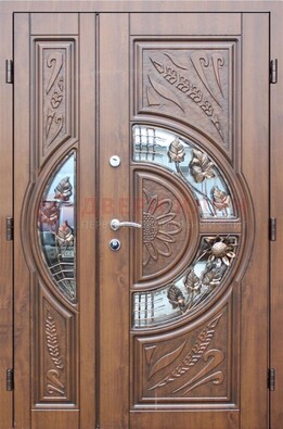 Уличная дверь в цвете Итальянский орех с виноритом и ковкой со стеклом ДВТ-147 в Егорьевске